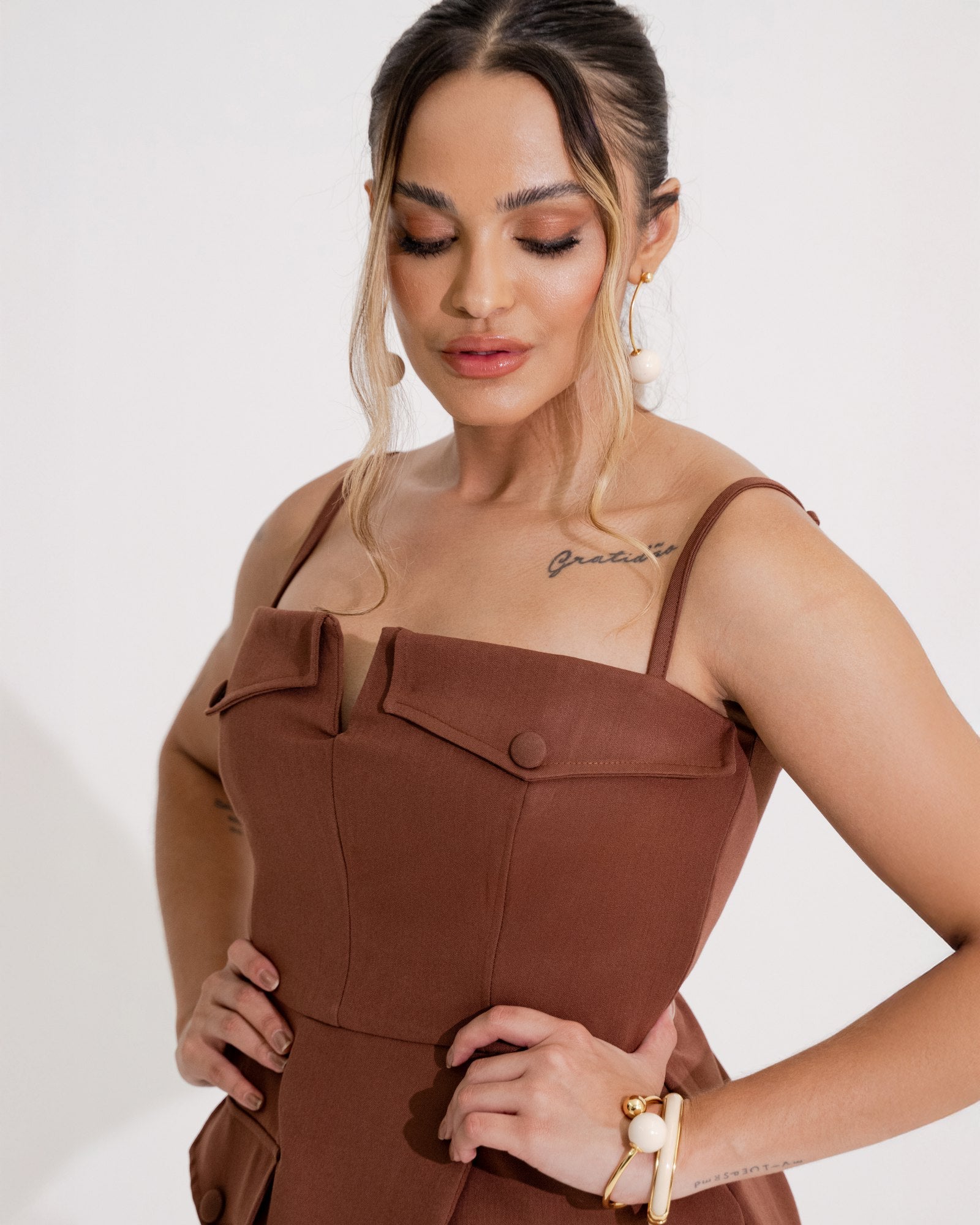 BLUSA PEPLUM ASSIMÉTRICO COM LAPELAS